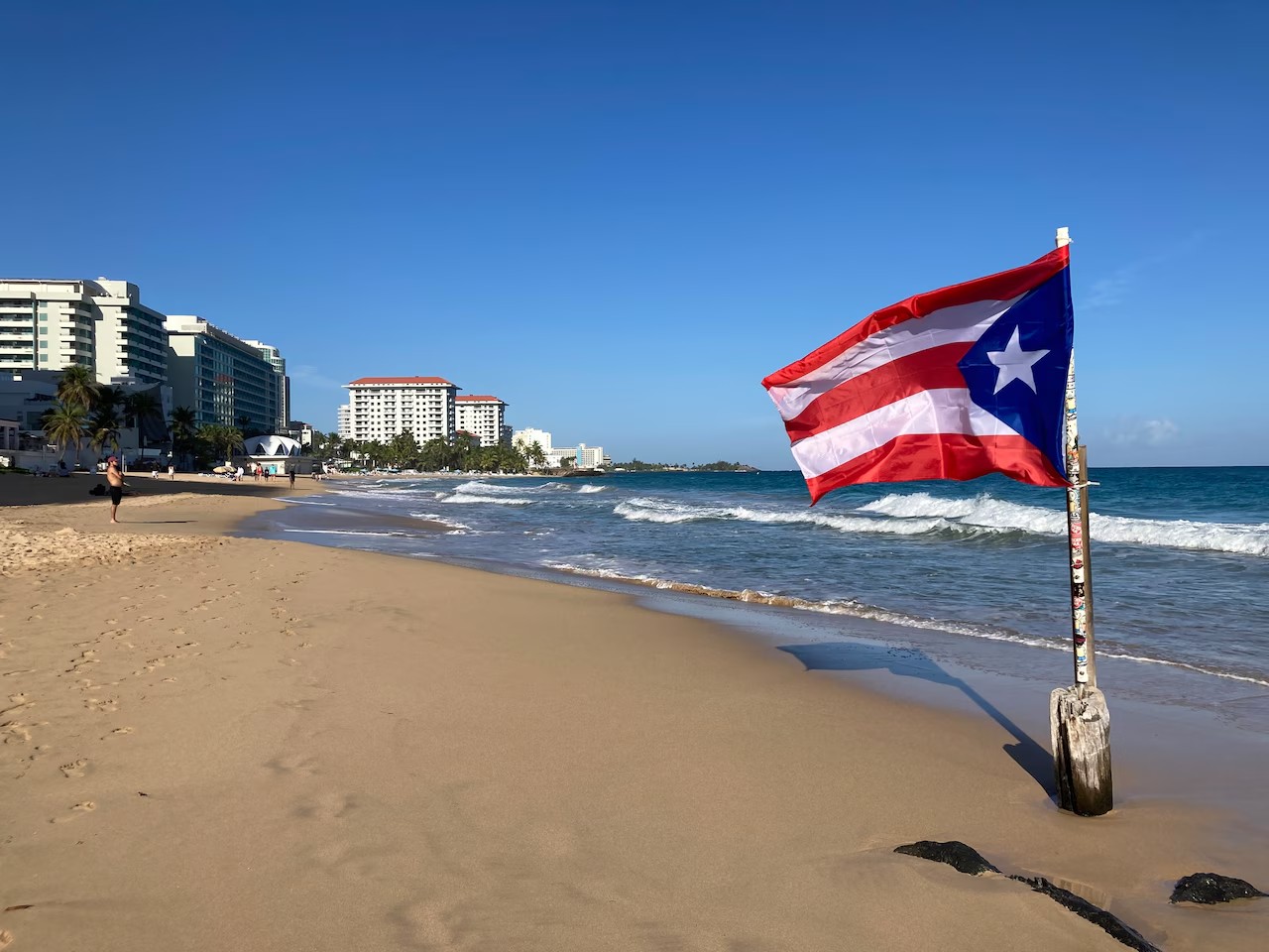 Beach with Puerto Rico flag waving in the wind